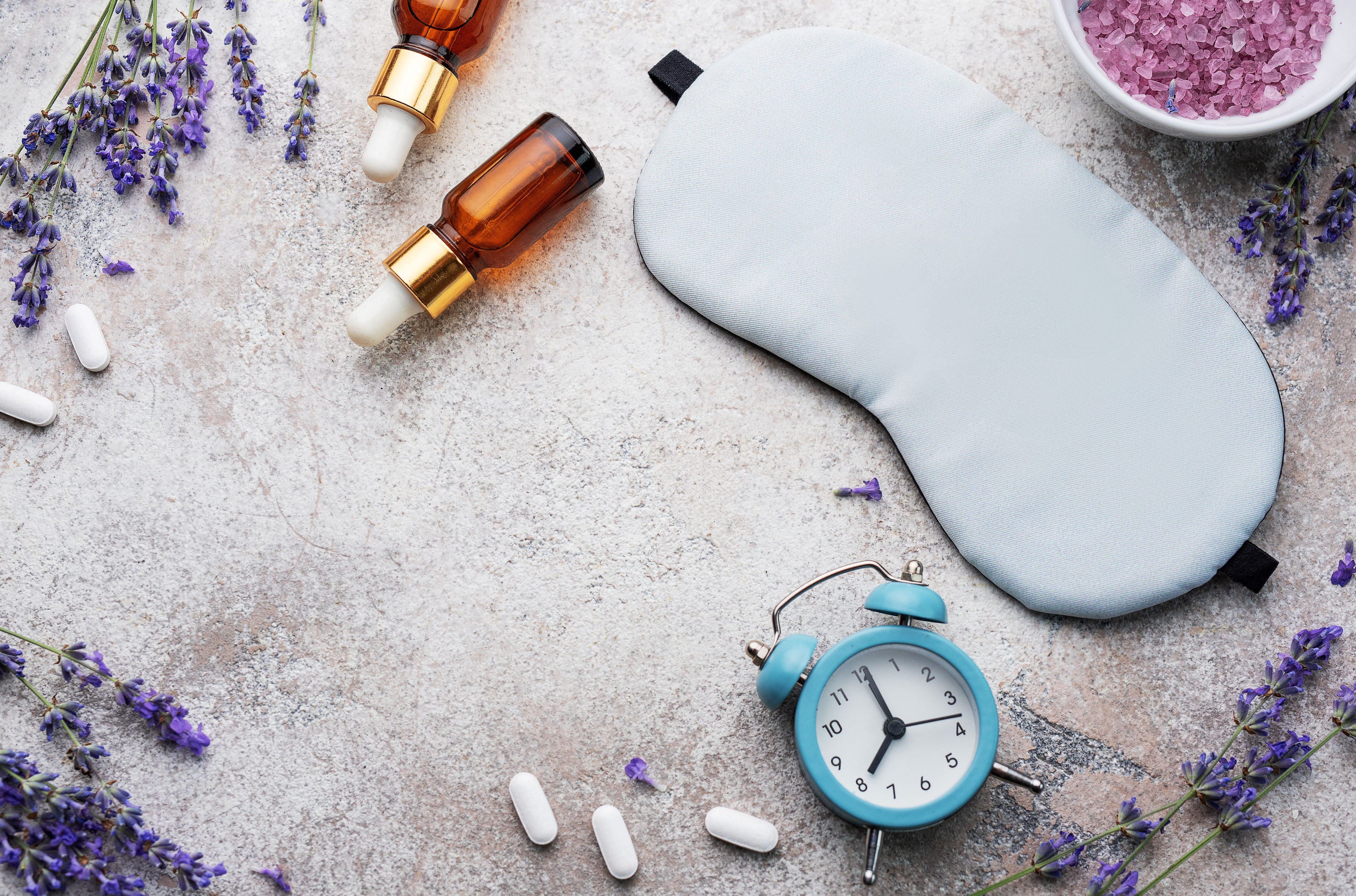 Sleep and mood support essentials including sleep mask, lavender, supplements, and calming aromatherapy oils for restful sleep and stress relief.